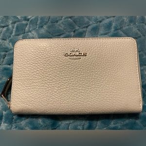 Excellent used coach wallet. Light teal with silver hardware.